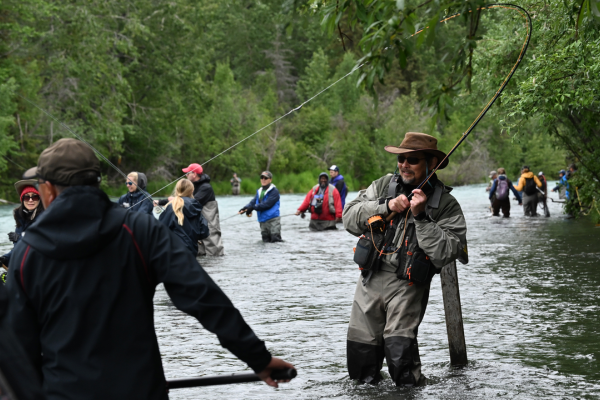 Anglers dip netting in the Kasilof River during peak sockeye season in Alaska