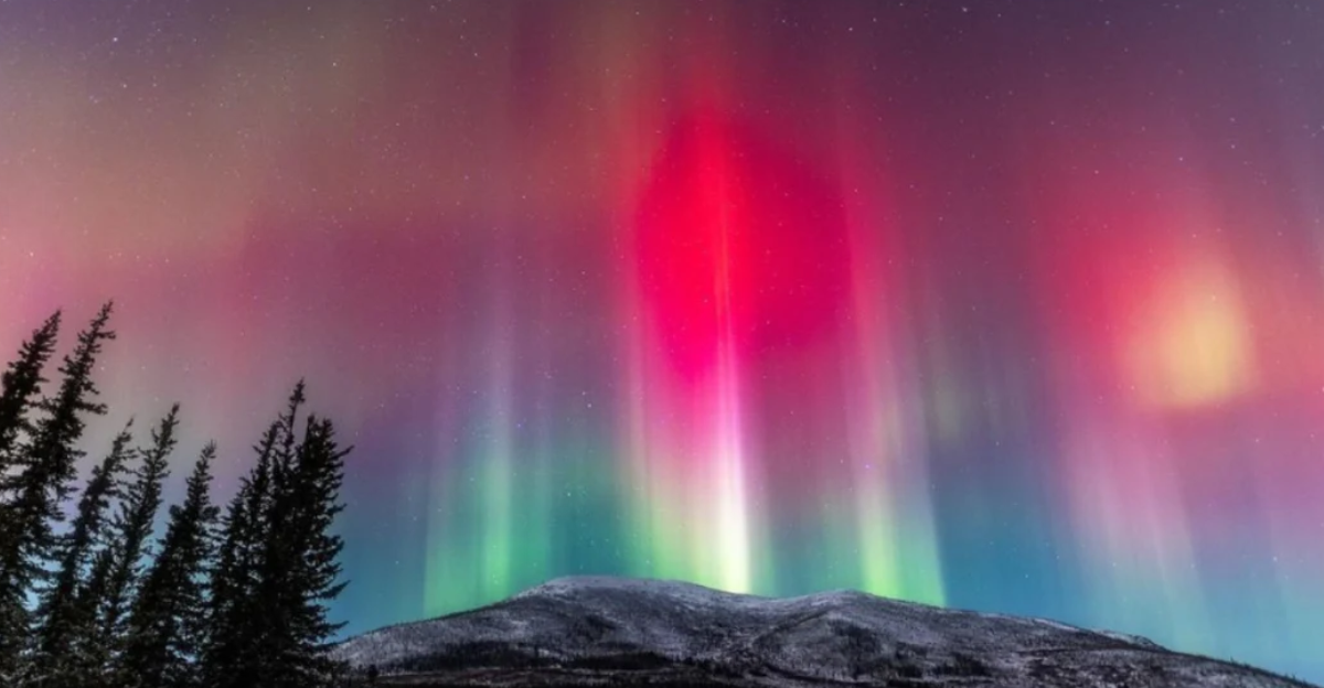 Northern lights dancing over Alaska mountains during late November near Sterling